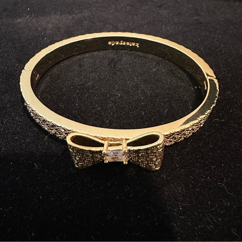 Kate spade Wrapped In a Bow Gold Bangle Bracelet with Center Crystal